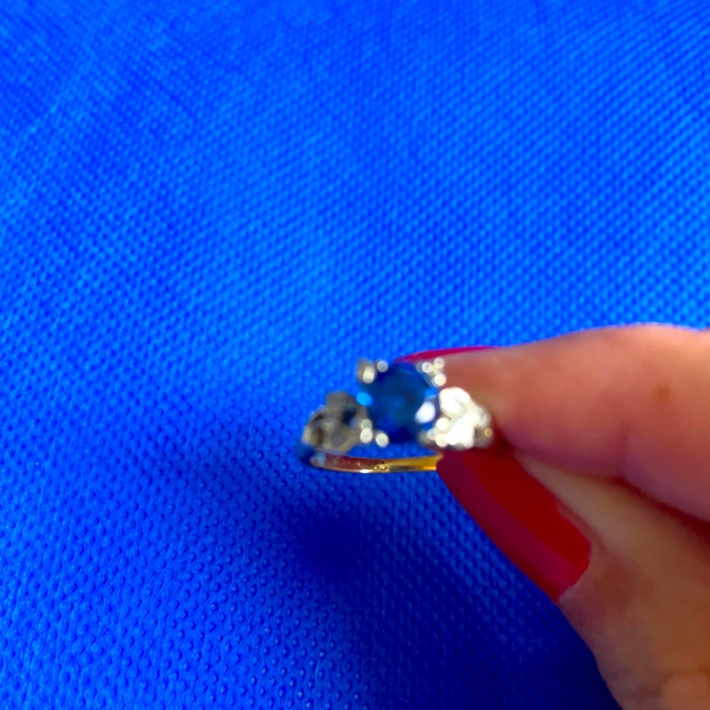 A stunning sapphire and diamond in 14K white and yellow gold ring.